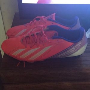 Pink and purple adidas soccer cleats